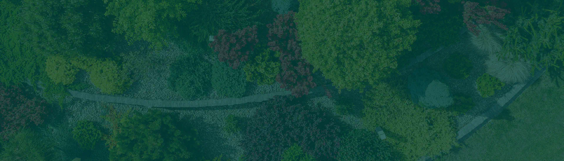 Veduta dall'alto di un giardino con siepi, vialetti e alberature